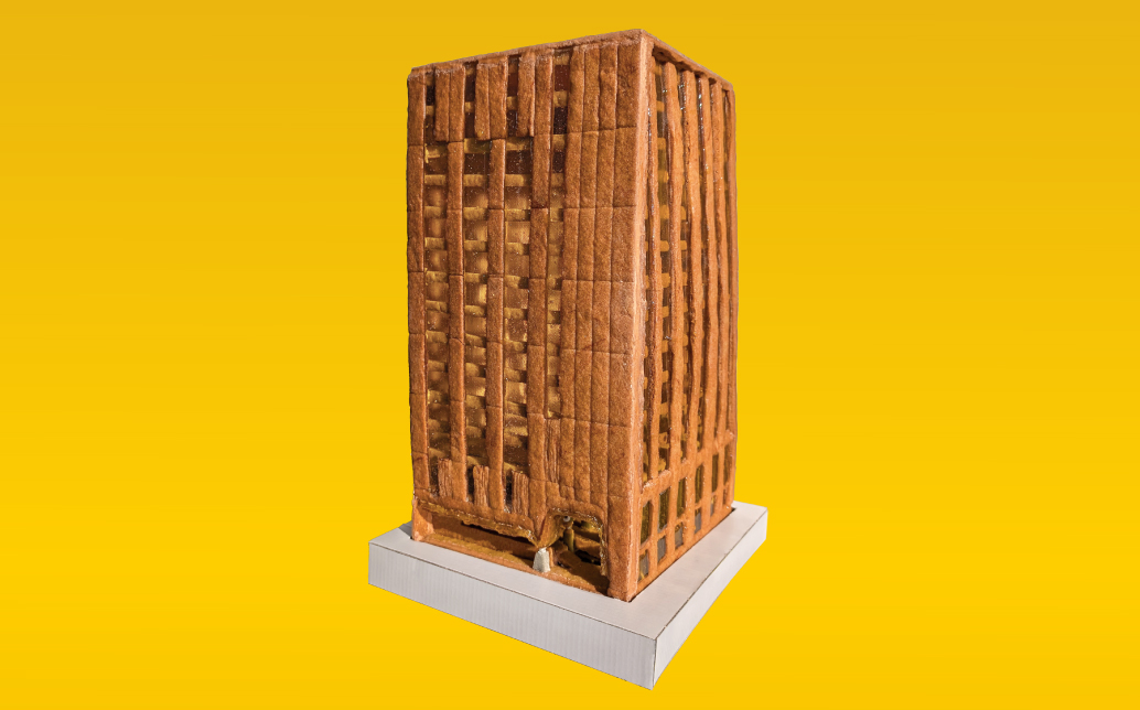 A tower made of gingerbread with an intricate lobby.